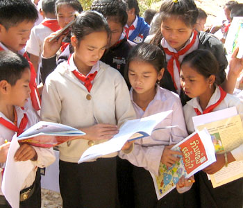 The book Aijethai and other traditional stories from Laos being read