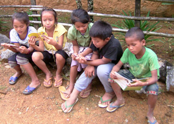 Kids reading in a Phou Khoun village