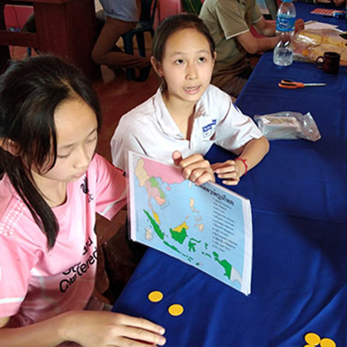 Lao students play a game called World Traveler